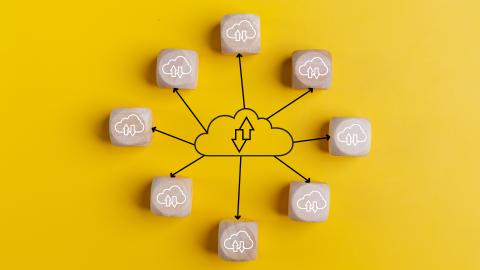 cloud-computing-concept-with-wooden-cubes-on-a-yel-